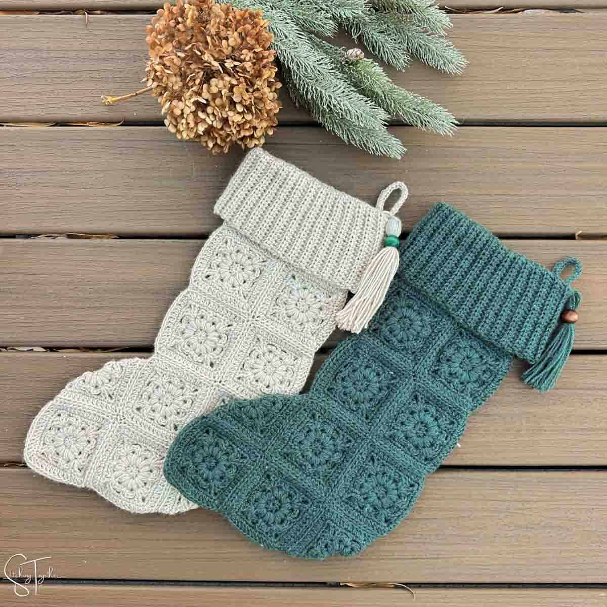 2 granny square crochet stocking laying flat.