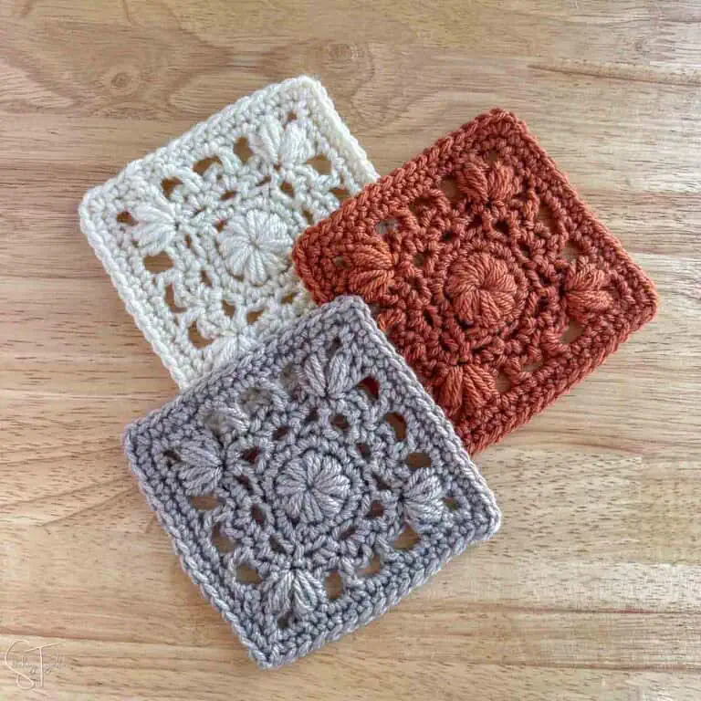 3 unique pretty granny squares laying flat