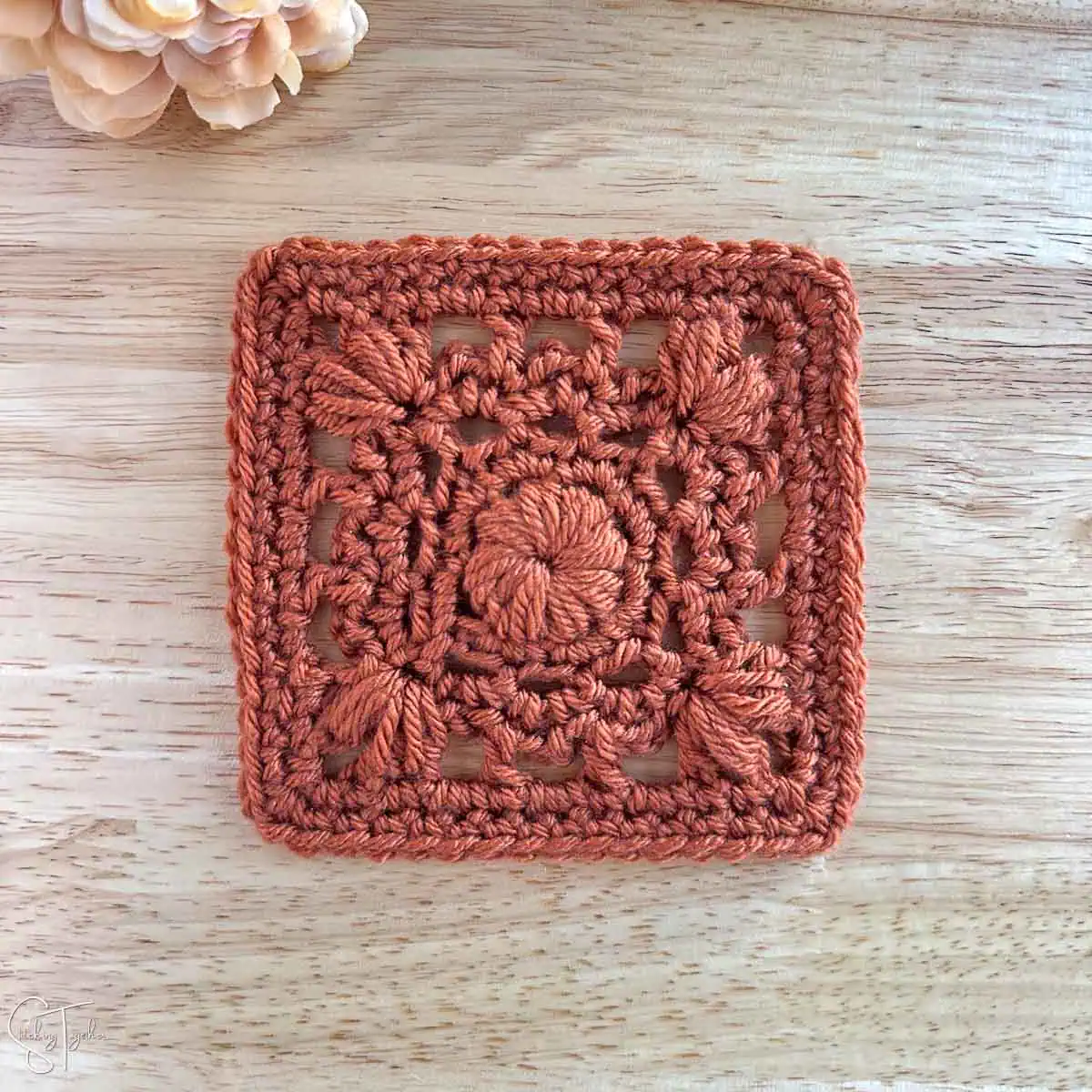 granny square motif with puff stitches