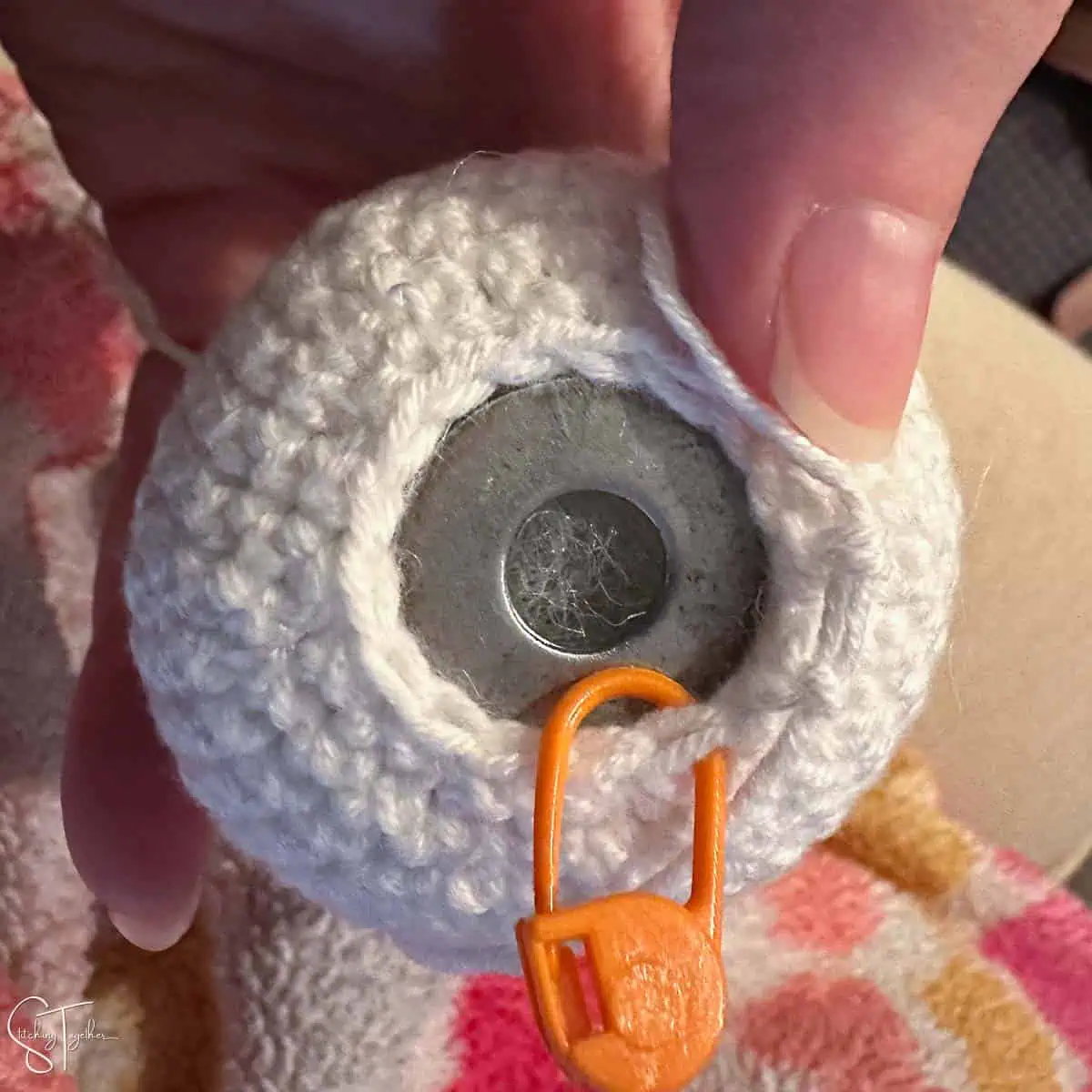 washer at the bottom of an amigurumi project