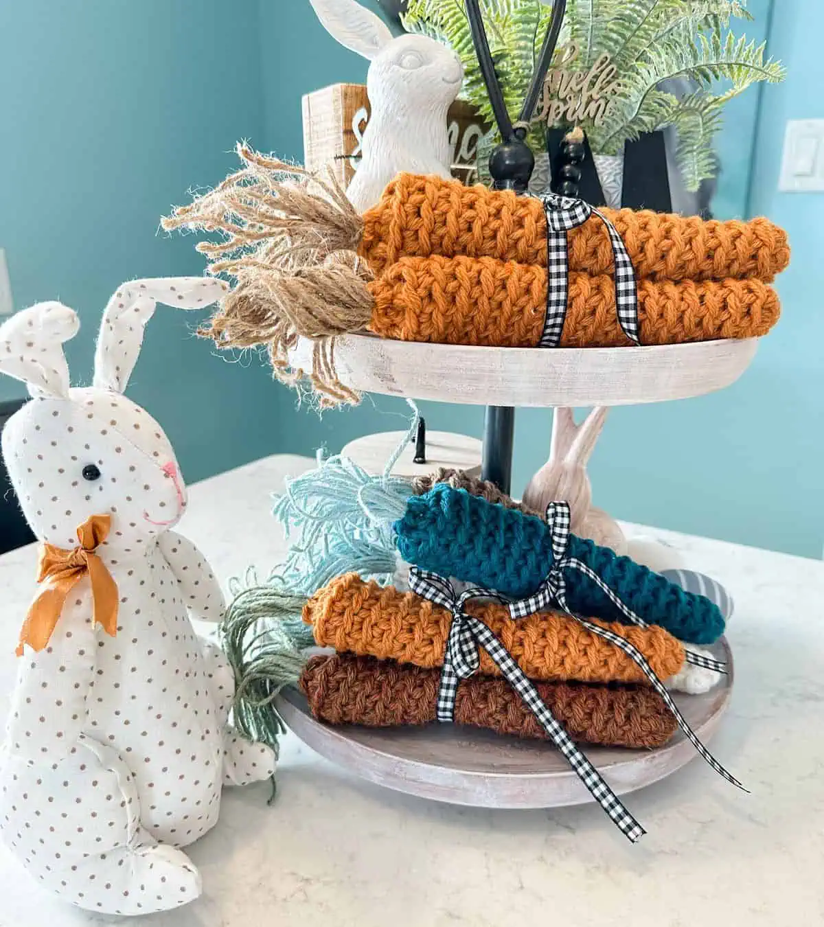 crochet carrots stacked on tiered plates