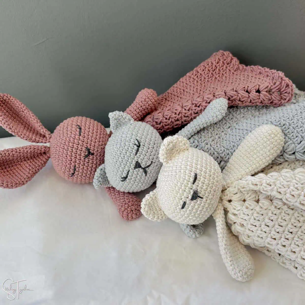 3 crochet loveys laying next to each other